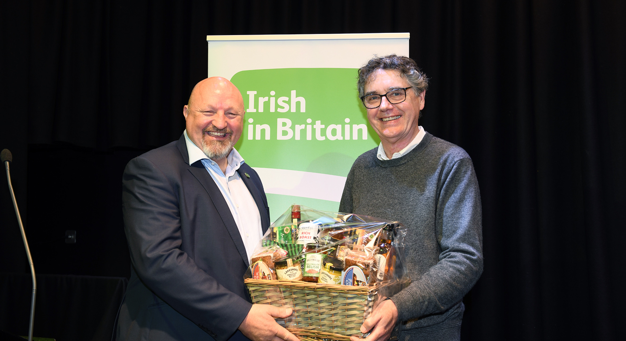 Sean McLaughlin presents an Irish Shop hamper to Ant Hanlon representing Rachael Loftus